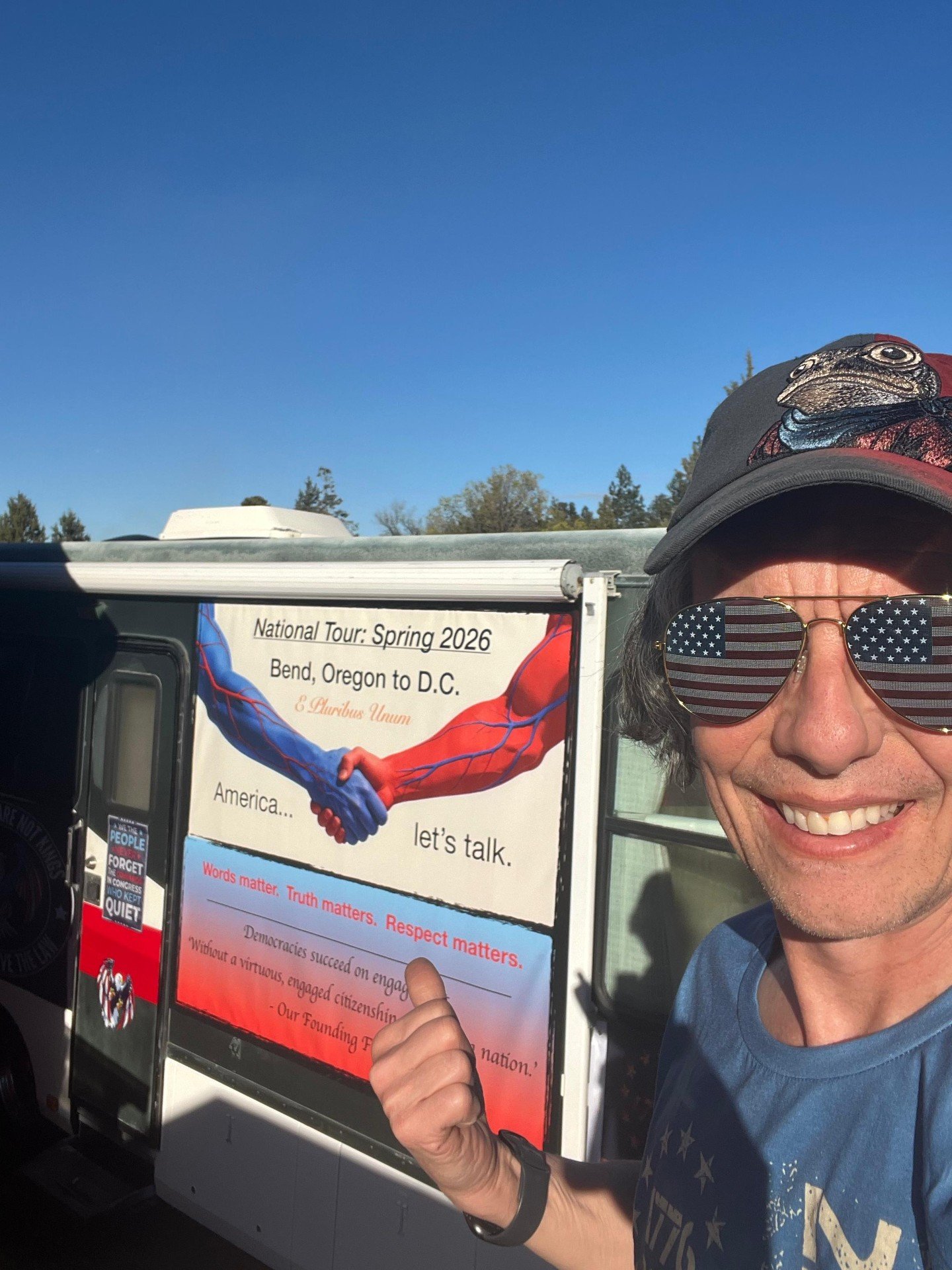 The founder of Tan Suit Guy with his RV